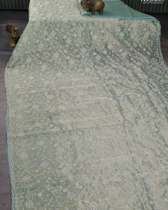 Tissue silk saree pastel green with allover embroidery & sequin work and beaded work border