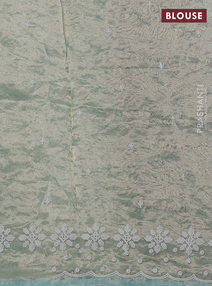 Tissue silk saree pastel green with allover embroidery & sequin work and beaded work border