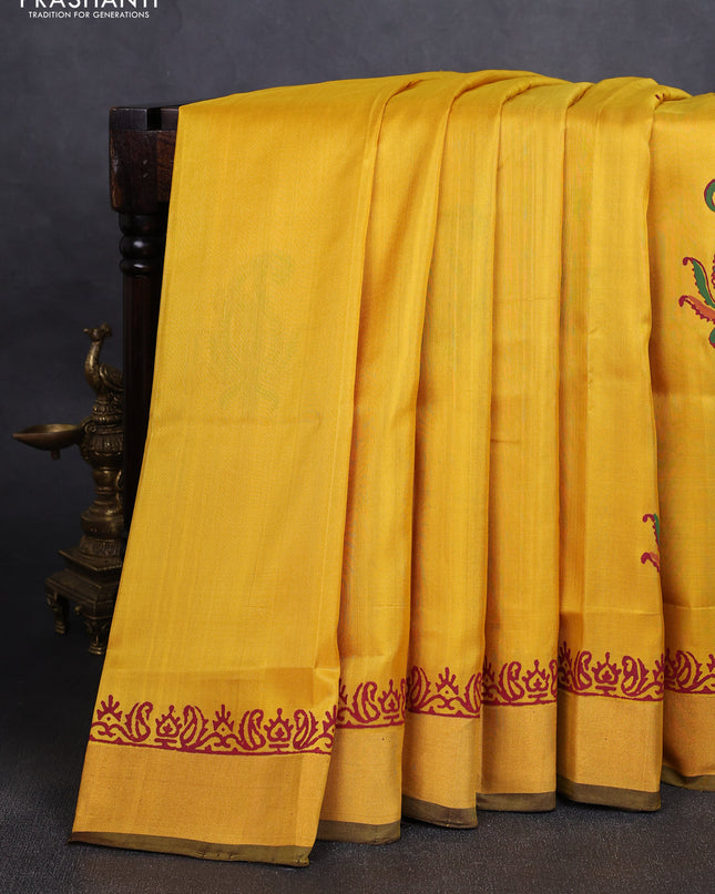 Uppada block printed silk saree lime yellow and coffee brown with paisley butta prints and zari woven border