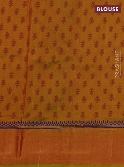 Uppada block printed silk saree rustic orange and dual tone musatrd green with floral butta prints and zari woven border