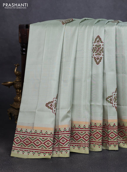 Uppada block printed silk saree pastel green shade with butta prints and zari woven printed border