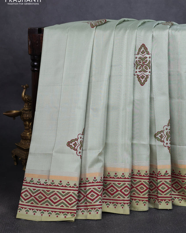Uppada block printed silk saree pastel green shade with butta prints and zari woven printed border