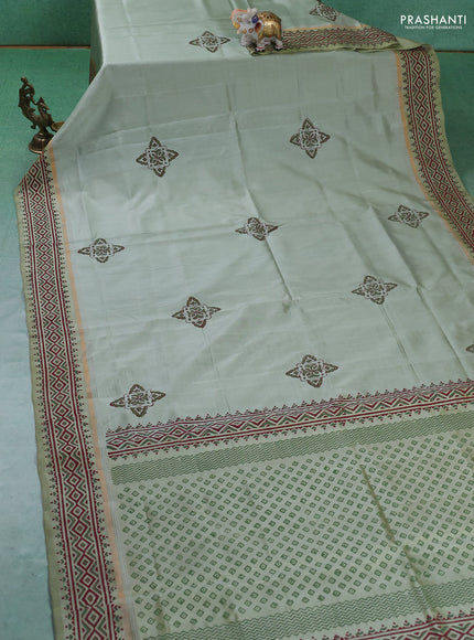 Uppada block printed silk saree pastel green shade with butta prints and zari woven printed border