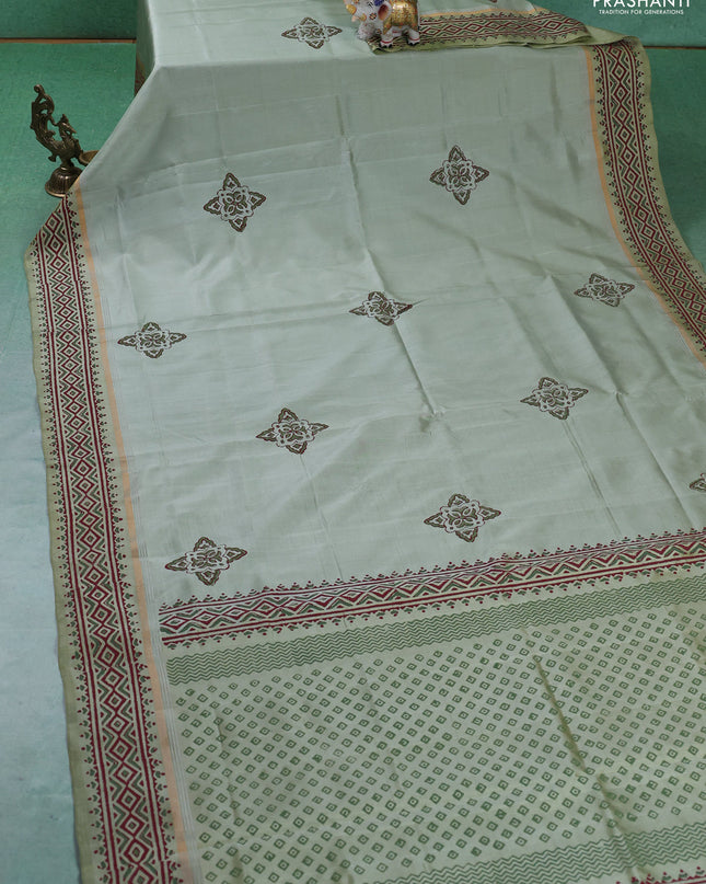 Uppada block printed silk saree pastel green shade with butta prints and zari woven printed border
