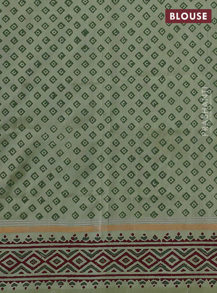 Uppada block printed silk saree pastel green shade with butta prints and zari woven printed border