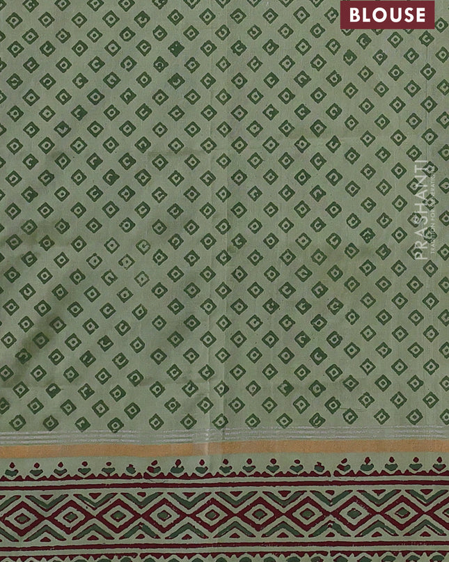 Uppada block printed silk saree pastel green shade with butta prints and zari woven printed border