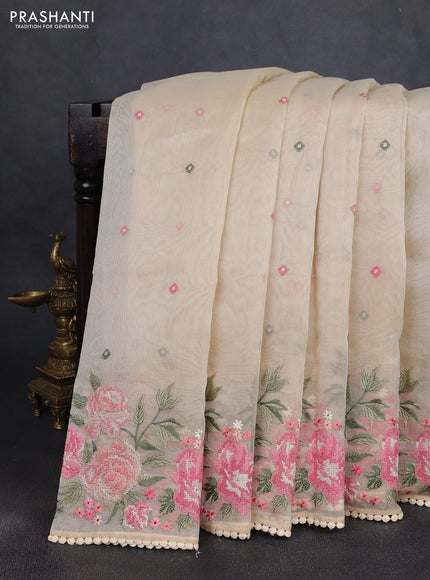 Chander tissue saree cream with embroidery work and floral embroidery border