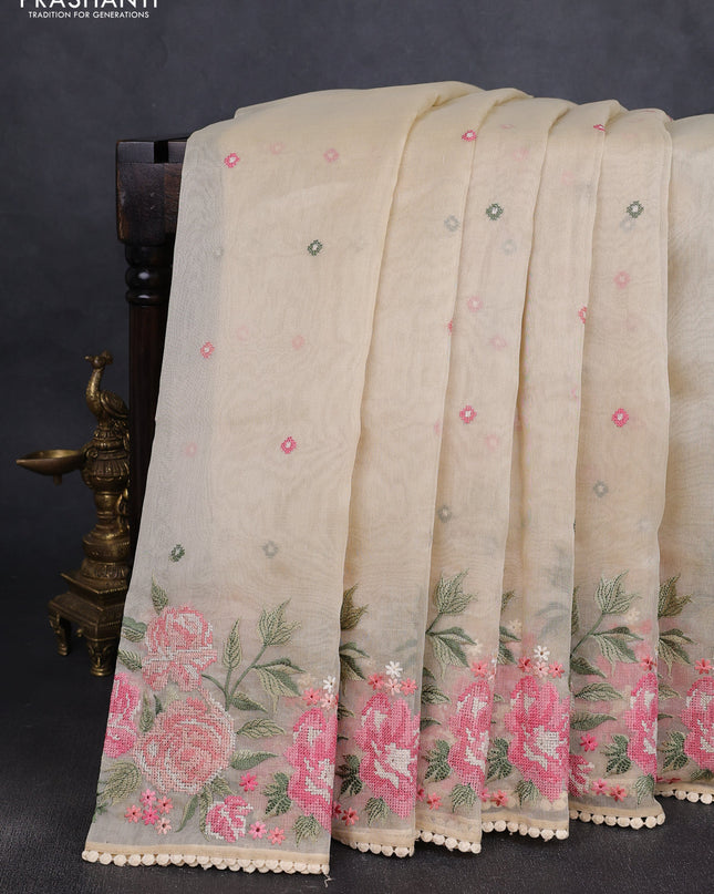 Chander tissue saree cream with embroidery work and floral embroidery border
