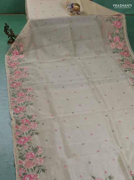Chander tissue saree cream with embroidery work and floral embroidery border