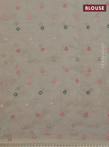 Chander tissue saree cream with embroidery work and floral embroidery border