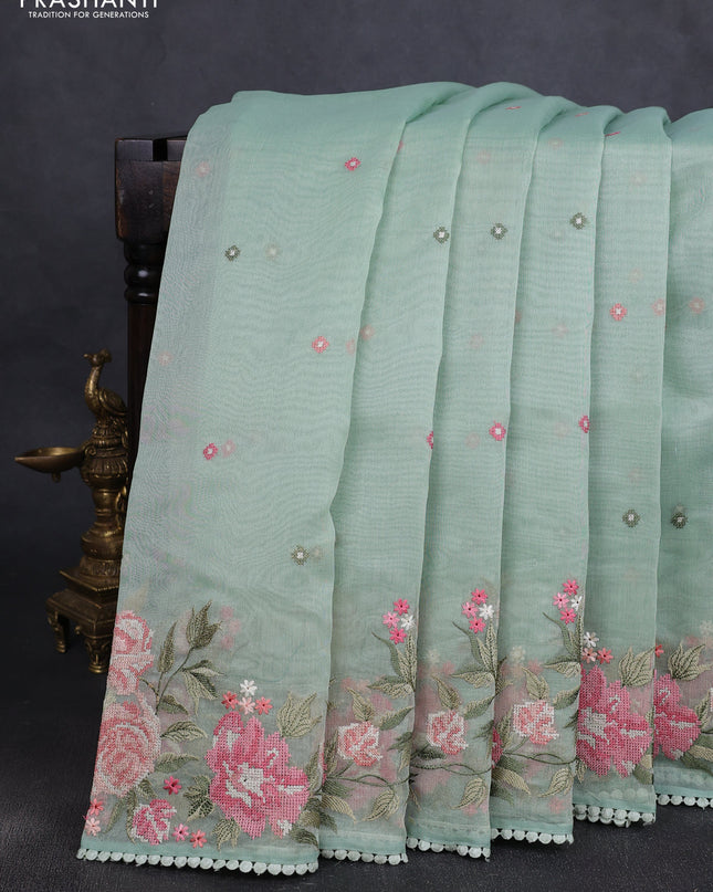 Chander tissue saree pastel green with embroidery work and floral embroidery border