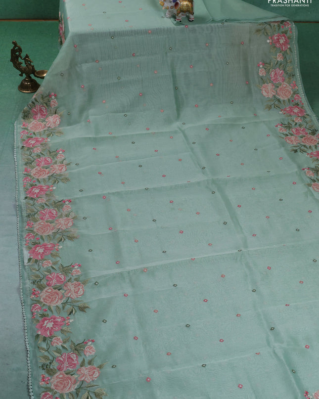 Chander tissue saree pastel green with embroidery work and floral embroidery border