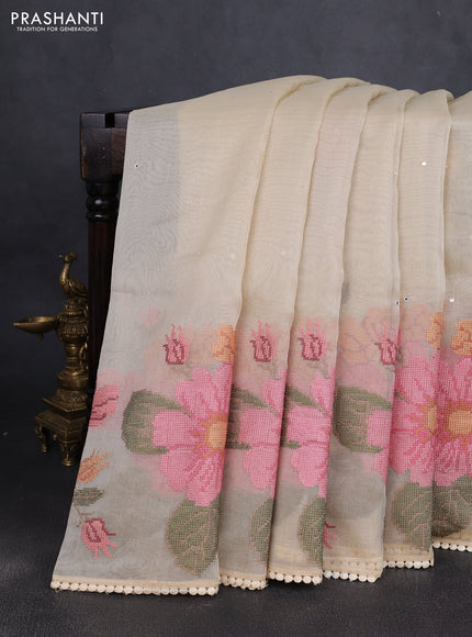 Chander tissue saree cream with mirror embroidery work and floral embroidery border