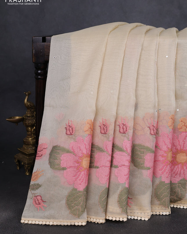 Chander tissue saree cream with mirror embroidery work and floral embroidery border