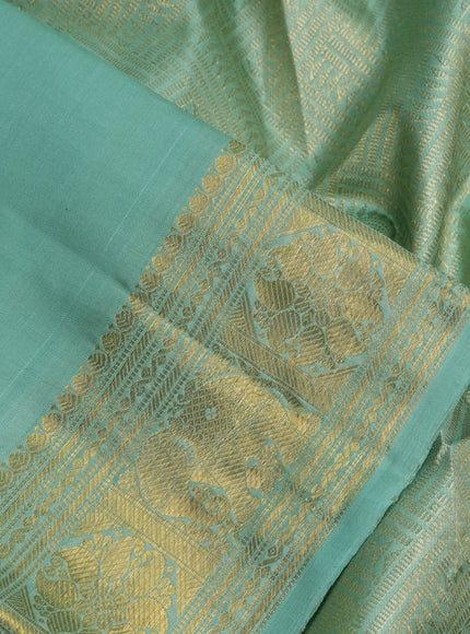 Pure kanchipuram silk saree pastel green with zari woven buttas and zari woven border