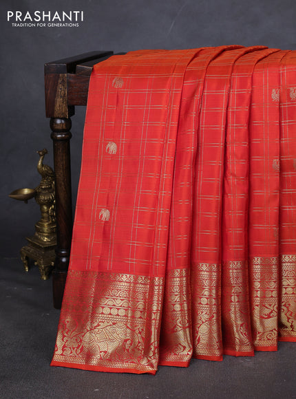 Pure kanchipuram silk saree orange with allover zari checks & buttas and zari woven border