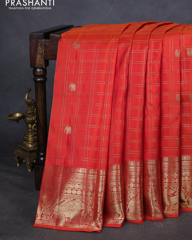 Pure kanchipuram silk saree orange with allover zari checks & buttas and zari woven border
