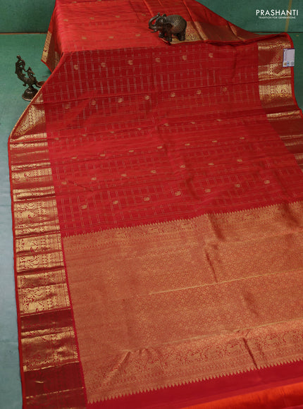 Pure kanchipuram silk saree orange with allover zari checks & buttas and zari woven border