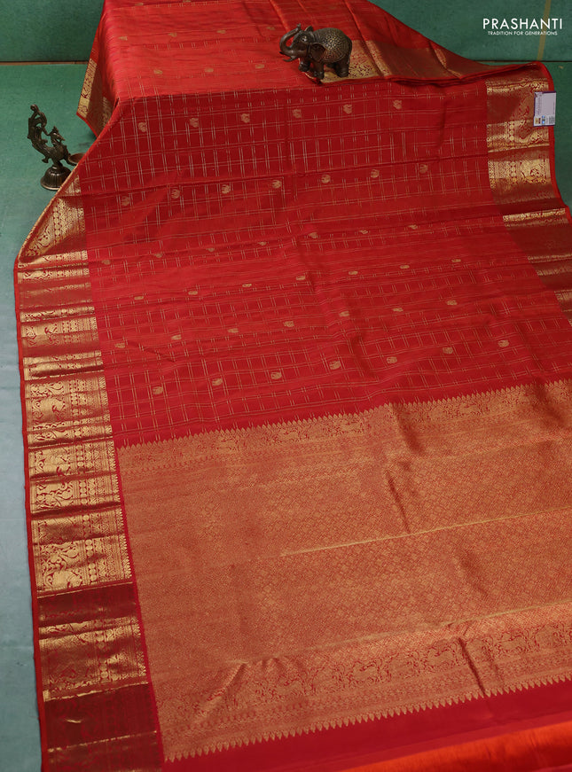 Pure kanchipuram silk saree orange with allover zari checks & buttas and zari woven border