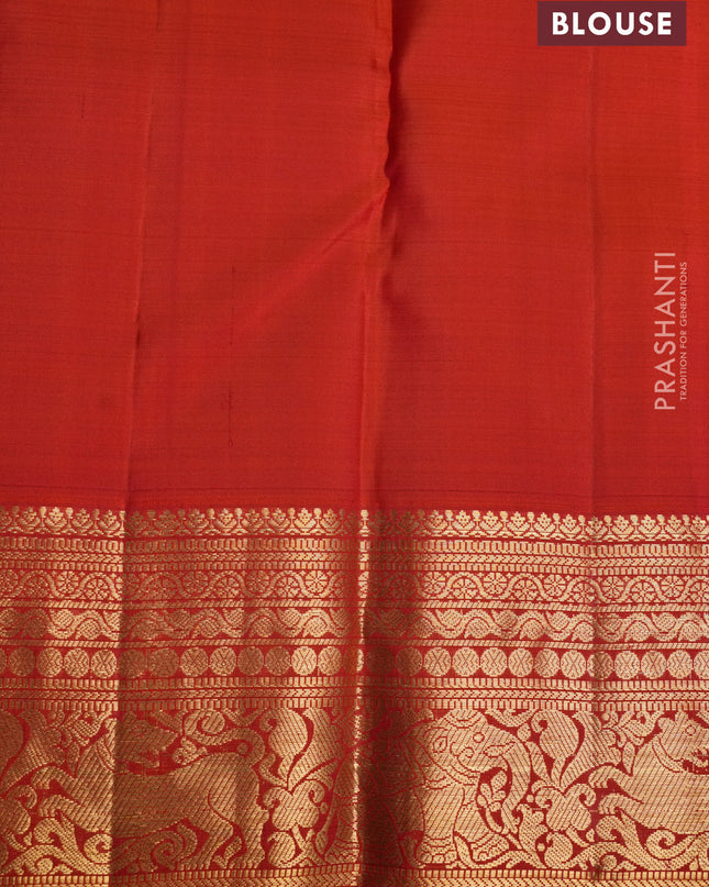 Pure kanchipuram silk saree orange with allover zari checks & buttas and zari woven border