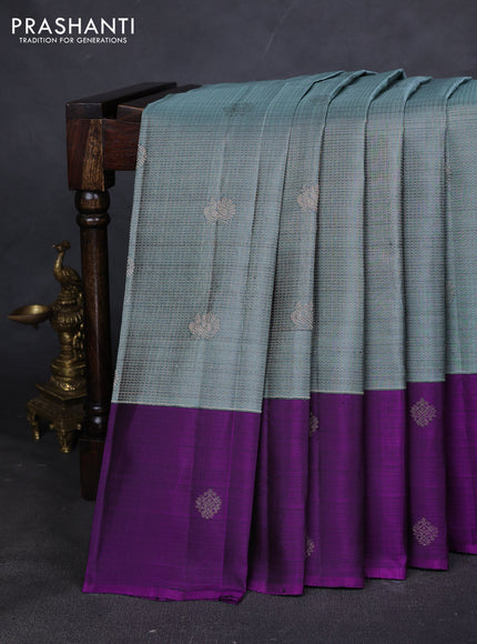 Pure kanchipuram silk saree pastel blue and purple with allover zari checks & buttas and zari woven butta border