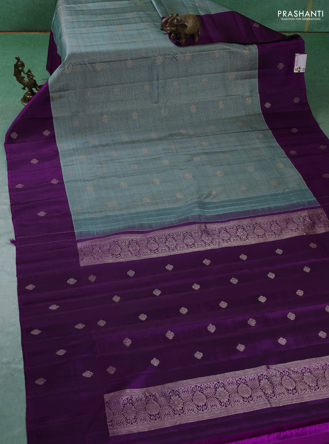 Pure kanchipuram silk saree pastel blue and purple with allover zari checks & buttas and zari woven butta border