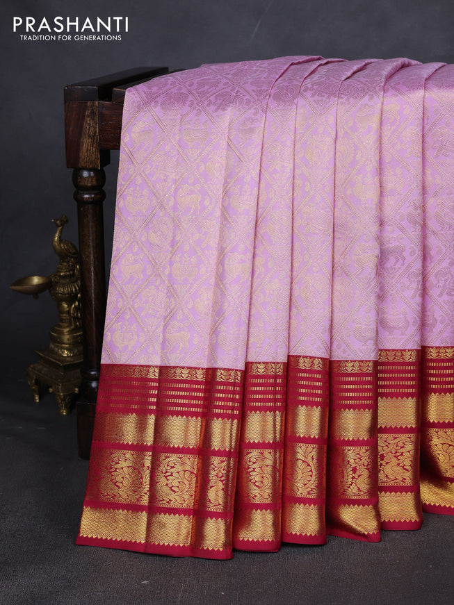 Pure kanchipuram silk saree light pink and red with allover zari woven brocade weaves and zari woven border