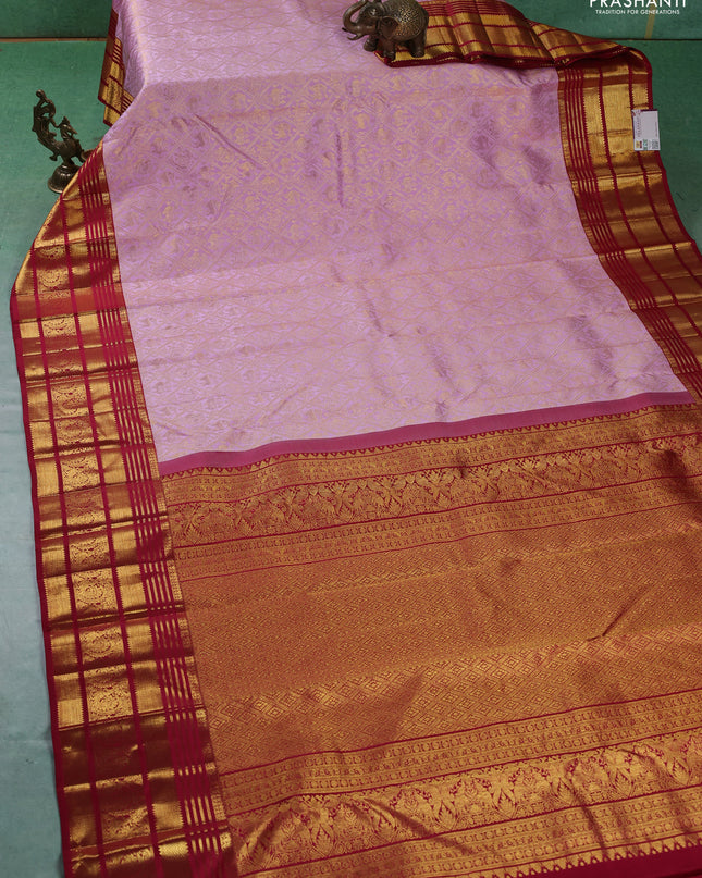 Pure kanchipuram silk saree light pink and red with allover zari woven brocade weaves and zari woven border