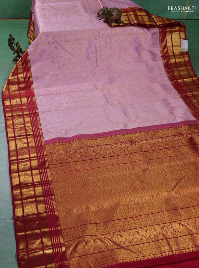 Pure kanchipuram silk saree light pink and red with allover zari woven brocade weaves and zari woven border