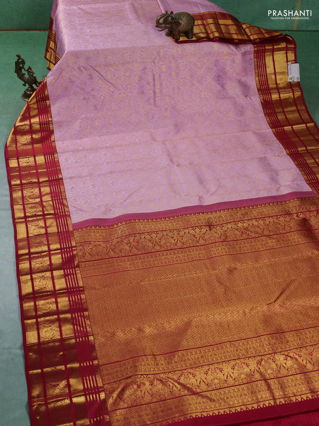 Pure kanchipuram silk saree light pink and red with allover zari woven brocade weaves and zari woven border