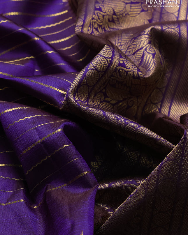 Pure kanchipuram silk saree violet with allover zari weaves and long temple design zari woven border