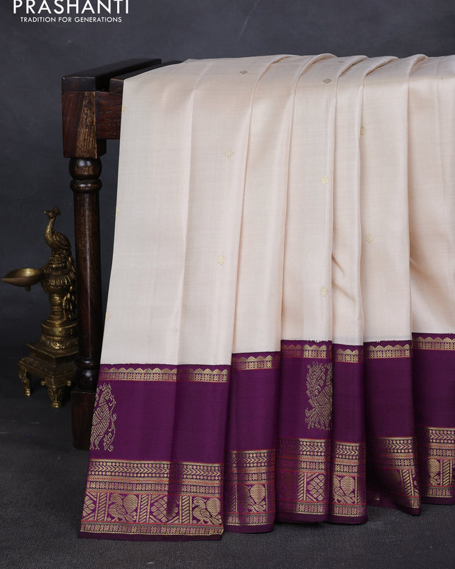 Pure kanchipuram silk saree cream and purple with zari woven buttas and long rich zari woven korvai border