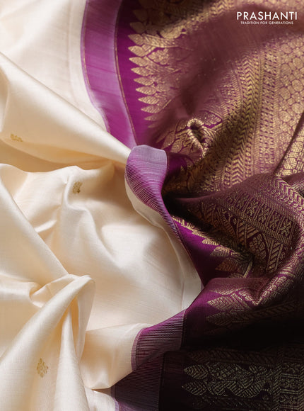 Pure kanchipuram silk saree cream and purple with zari woven buttas and long rich zari woven korvai border