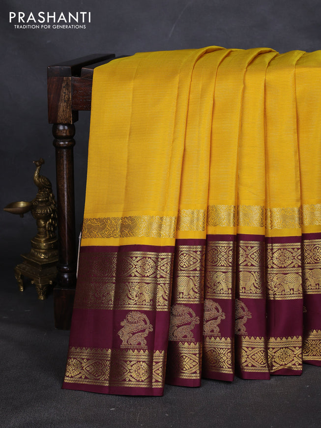 Pure kanchipuram silk saree yellow and wine shade with allover vairaosi pattern and long rich zari woven korvai border