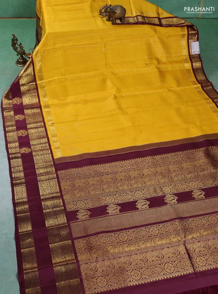 Pure kanchipuram silk saree yellow and wine shade with allover vairaosi pattern and long rich zari woven korvai border