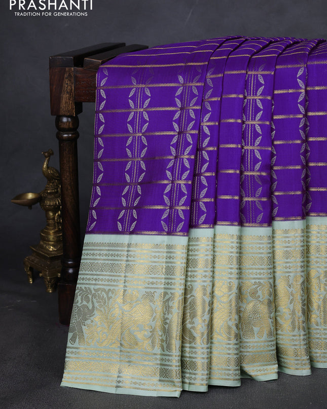 Pure kanchipuram silk saree violet and pastel green with allover zari checks & silver zari weaves and long zari woven korvai border
