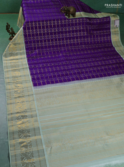 Pure kanchipuram silk saree violet and pastel green with allover zari checks & silver zari weaves and long zari woven korvai border