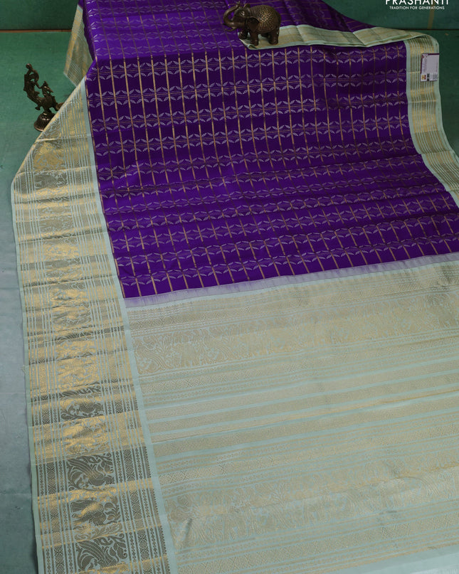 Pure kanchipuram silk saree violet and pastel green with allover zari checks & silver zari weaves and long zari woven korvai border
