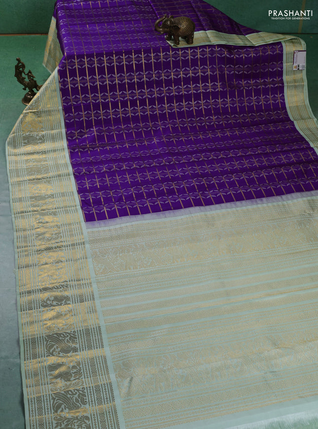 Pure kanchipuram silk saree violet and pastel green with allover zari checks & silver zari weaves and long zari woven korvai border