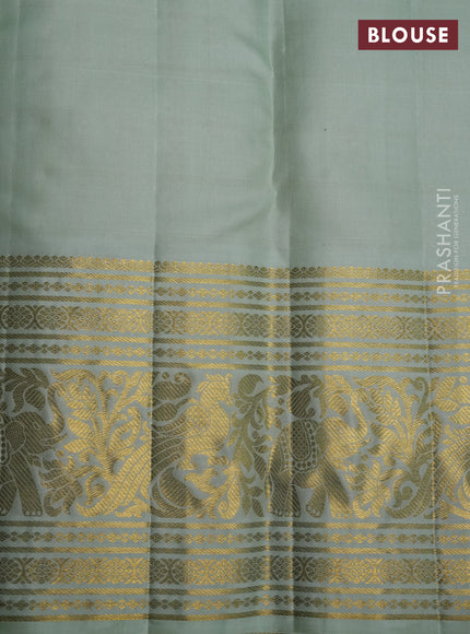 Pure kanchipuram silk saree violet and pastel green with allover zari checks & silver zari weaves and long zari woven korvai border