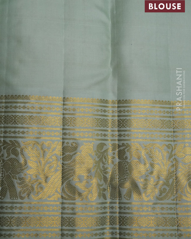 Pure kanchipuram silk saree violet and pastel green with allover zari checks & silver zari weaves and long zari woven korvai border