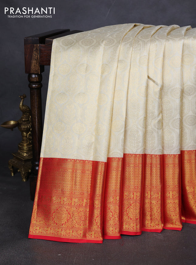 Pure kanchipuram silk saree cream and red with allover zari woven butta weaves and zari woven border