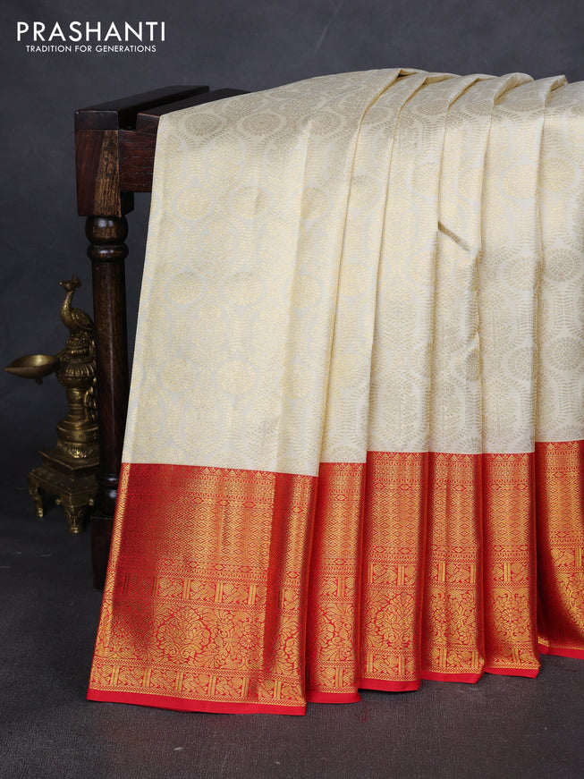 Pure kanchipuram silk saree cream and red with allover zari woven butta weaves and zari woven border