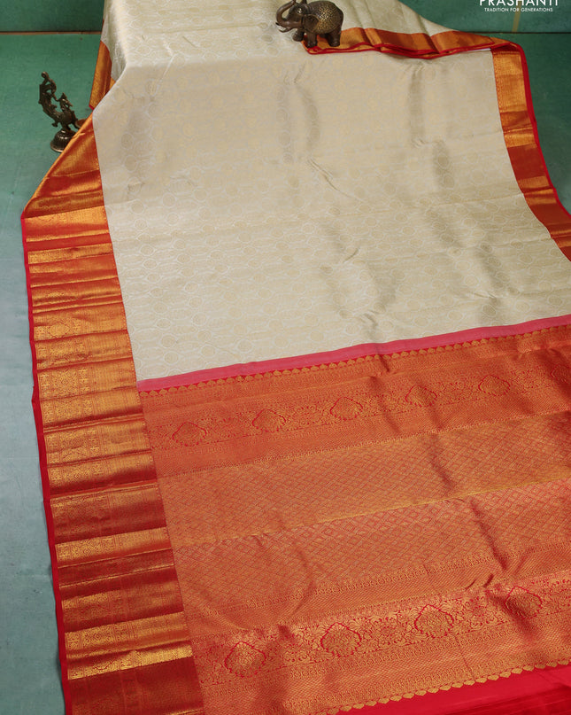 Pure kanchipuram silk saree cream and red with allover zari woven butta weaves and zari woven border