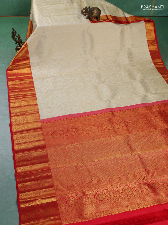Pure kanchipuram silk saree cream and red with allover zari woven butta weaves and zari woven border