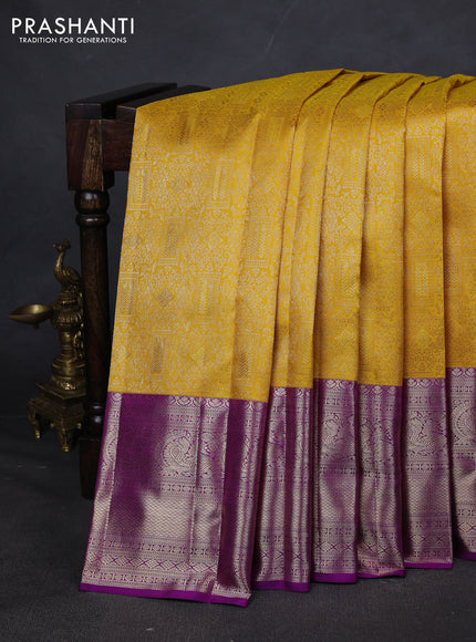 Pure kanchipuram silk saree yellow and purple with allover zari woven brocade weaves and zari woven border