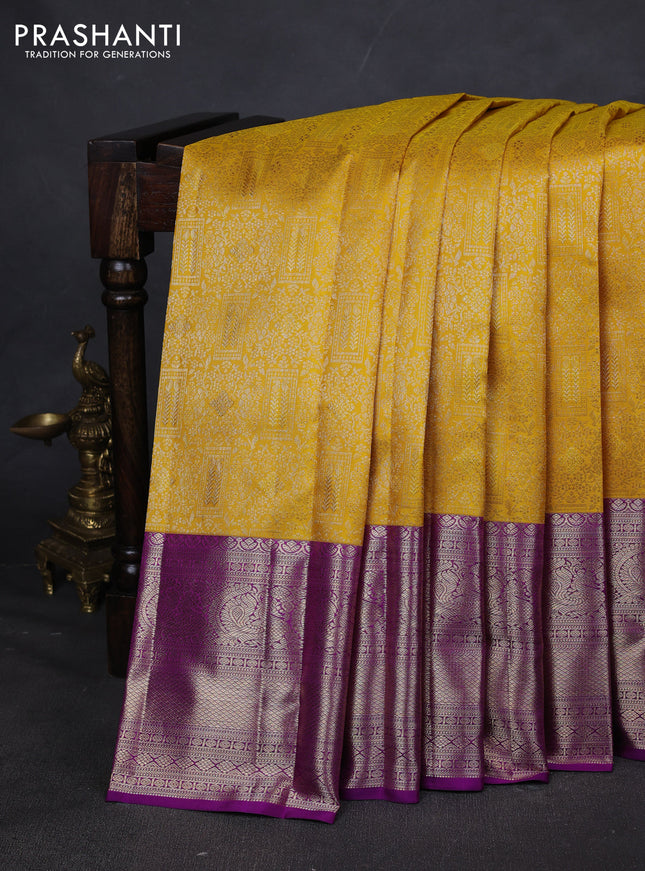 Pure kanchipuram silk saree yellow and purple with allover zari woven brocade weaves and zari woven border