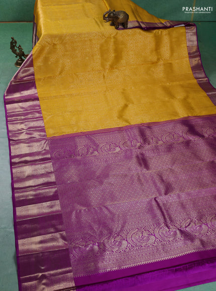 Pure kanchipuram silk saree yellow and purple with allover zari woven brocade weaves and zari woven border