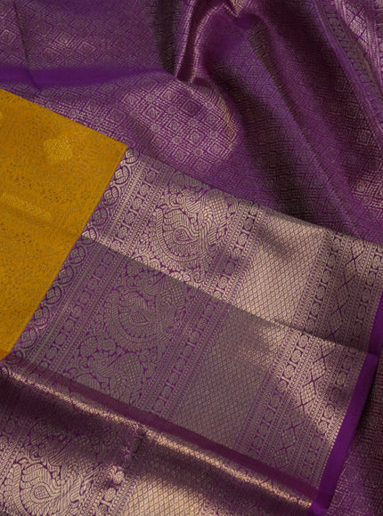 Pure kanchipuram silk saree yellow and purple with allover zari woven brocade weaves and zari woven border