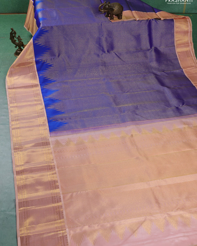 Pure kanchipuram silk saree royal blue and pale orange with allover zari weaves and zari woven korvai border